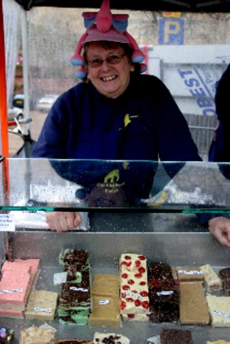 Lynne Grebenik sports her pink elephant hat at her fudge stall. Photo: Rachel Connelly