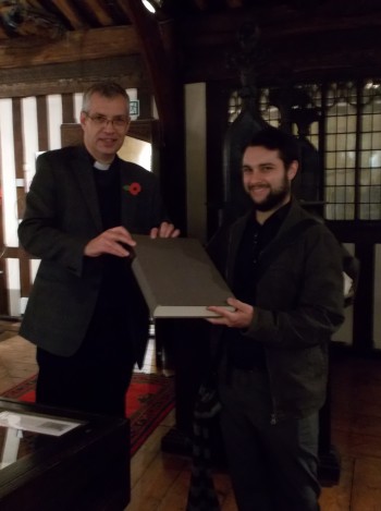 The Canon Chancellor at Lincoln Cathedral presents the facsimile to James Wakefield