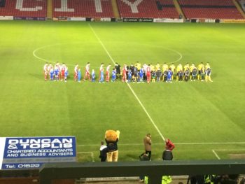 The teams came out to an energetic atmosphere at Sincil Bank. (Photo: Ryan Petterson)