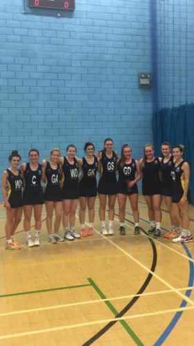 The University of Lincoln women's first team celebrate their first win with a team photo.