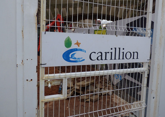 Carillion logo text on a metal gate.